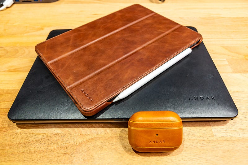 Andar leather cases showcased on various Apple devices