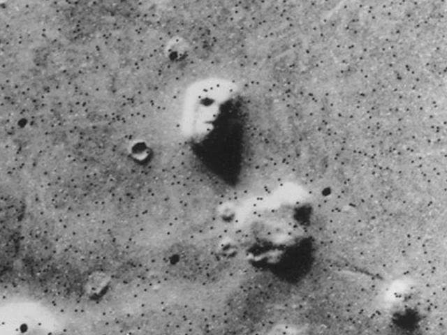 The intriguing formation resembling a human face on Mars.