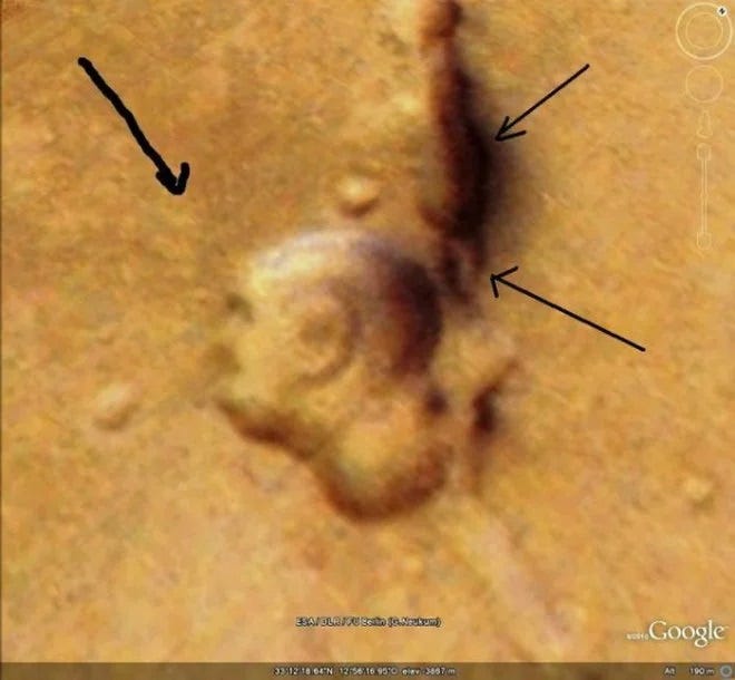 Another formation on Mars resembling a bald man's head.